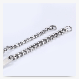 Macro view of stainless steel bar bracelet with lobster clasp and industrial chain links