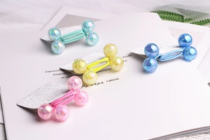 Macro detail of elastic hair ties with sparkly colorful beads on display cards