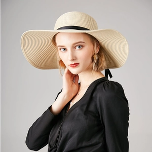 Elegant wide brim straw sun hat with black ribbon for women's summer sun protection