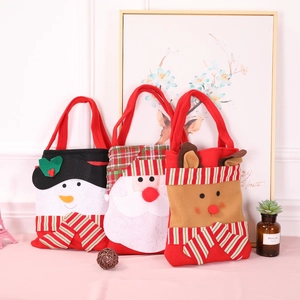 Detailed view of Santa, Snowman, and Reindeer non-woven Christmas gift bags set
