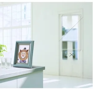Detail of vintage light blue wooden frame with gold trim and lion illustration