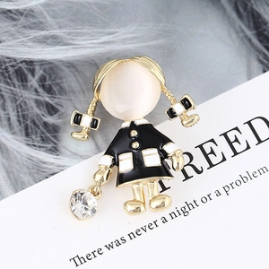 Detail of girl brooch with white opal face and black oil-drip dress with crystal charm