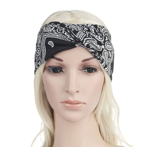 Detail of bohemian black and white paisley print headband with cross knot design