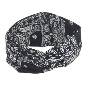Detail of bohemian black headband with white paisley print and twist knot design