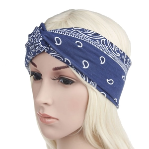 Navy blue paisley bandana headband featuring a criss-cross knot on a mannequin head