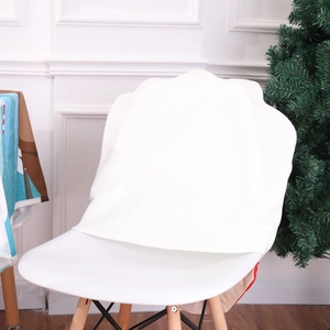 Close-up of white soft fabric chair cover with decorative scalloped edges for Christmas