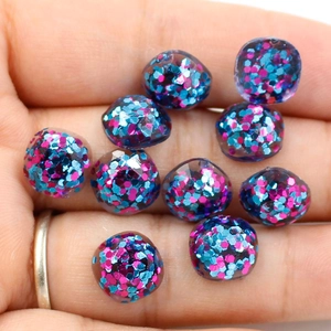 Glitter resin cabochon pendants with blue and pink sequins for DIY jewelry making