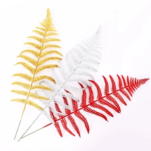 Christmas tree glittered fern leaf picks in gold, silver, and red colors on white backdrop