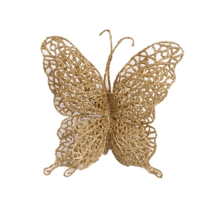 Macro shot of gold glittered hollow butterfly decoration for Christmas tree decor