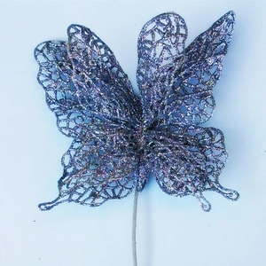 Detailed close-up of a purple glitter butterfly pick for Christmas tree decoration