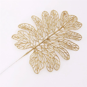 Detailed view of artificial golden glitter Persian leaf for Christmas tree decoration