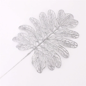 Detailed view of silver glittered artificial Persian leaf for Christmas tree decoration