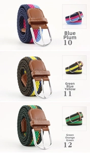 Detail of woven elastic belts in various color patterns with silver metal pin buckles