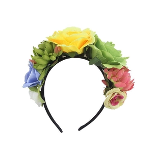 Detail of colorful artificial rose headband with vibrant silk flowers for festival parties