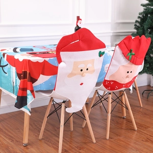 Christmas chair covers and tablecloth set featuring Santa Claus and Mrs. Claus motifs