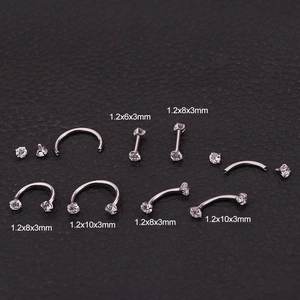 Macro view of stainless steel piercing rings with zircon studs in multiple sizes