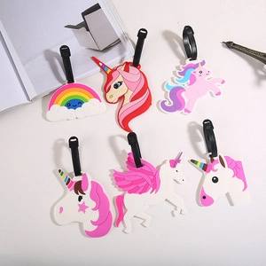 Detail of colorful cartoon unicorn and rainbow PVC luggage tags with black plastic straps