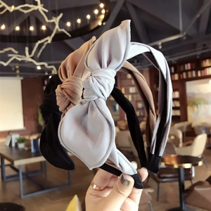 Set of minimalist fabric bow headbands in black beige and grey-blue colors
