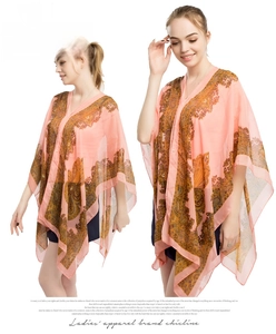 Detail view of pink paisley chiffon shawl showing lightweight fabric and boho pattern