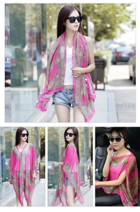 Detail of rose red paisley print chiffon shawl used as a stylish car sun protector