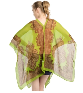 Detail of green paisley chiffon sun shawl with V-neck back and small white button closure