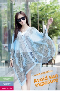 Detail of light blue paisley print chiffon sun protection shawl with batwing sleeves