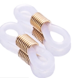 Detail view of transparent silicone anti-slip loops with golden metal rings for glasses