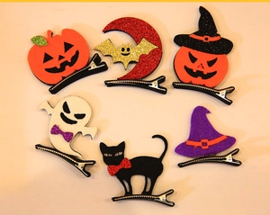 Detailed set of six felt Halloween hair clips featuring pumpkin, ghost, and black cat designs