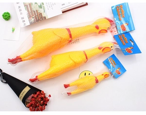 Three sizes of yellow screaming chicken rubber toys in mesh bags with retail packaging