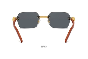 Detail of rimless square sunglasses with gold lion head hardware and wood texture temples
