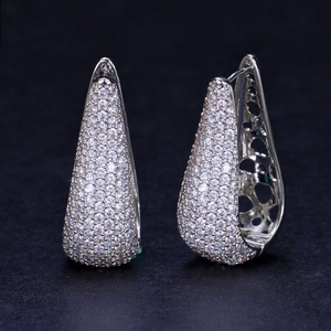 Elegant silver teardrop hoop earrings with full pavé cubic zirconia on black background
