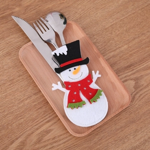 Macro detail of snowman felt cutlery holder showing pockets for knives and forks