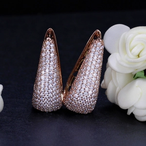 Elegant rose gold drop earrings with micro-pave cubic zirconia on dark background