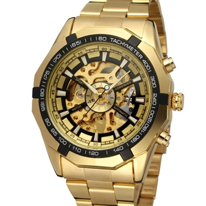 Close-up of golden skeleton automatic mechanical watch with black tachymeter bezel
