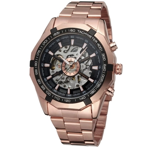 Macro shot of rose gold automatic watch dial with openwork skeleton movement and tachymeter