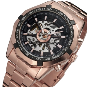 Detailed macro shot of the rose gold skeleton dial and automatic movement components
