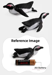 Detailed size comparison of realistic penguin figurines next to an AA battery