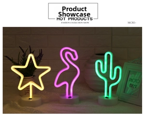 Detailed view of LED neon night lights in star, flamingo, and cactus shapes with round bases