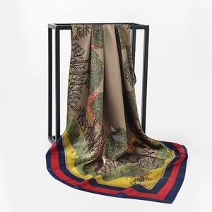 Detailed macro shot of satin silk scarf with digital floral tree print and glossy finish