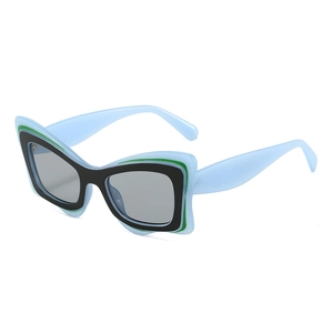 Lunettes de soleil cat-eye oversize avec monture multicouche et verres gris foncés