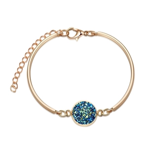 Detail of rose gold bracelet featuring a round teal druzy stone and adjustable clasp