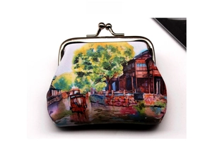 Detail view of kiss-lock closure and retro water town oil painting on the coin purse