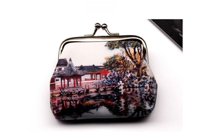 Detailed close-up of retro coin purse with Chinese garden landscape painting and metal clasp