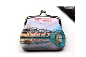 Detail of vintage retro purse featuring Chinese ancient town print and metal clasp