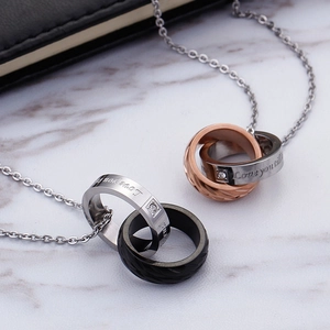 Interlocked double ring necklaces for couples in titanium steel with small diamonds