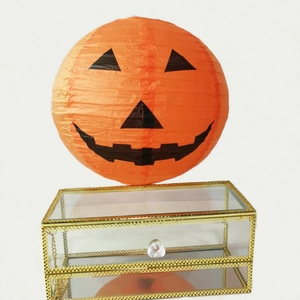 Double-layer glass jewelry box with gold metal frame and orange pumpkin lantern decoration