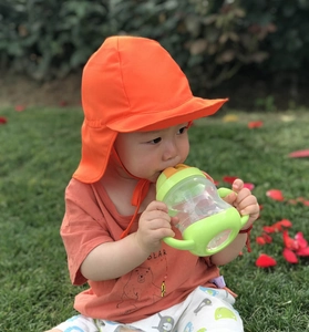 Orange sun hat for kids with wide brim and neck flap protection for summer outdoor use