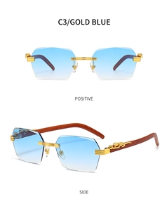Detail of blue gradient rimless sunglasses featuring golden leopard metal decoration