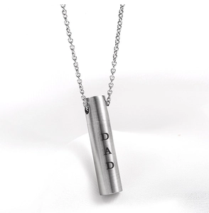 Close-up of a silver stainless steel urn necklace with vertical DAD engraving