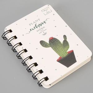 Detail of A7 coil notebook featuring a cute cactus print and decorative typography
